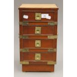 A small leather topped bank of drawers. 38 cm high.