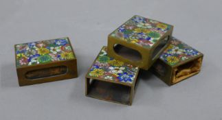 Four cloisonne matchbox holders. Each 4.5 cm long.