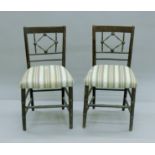 A pair of 19th century faux bamboo chairs. 44 cm wide.