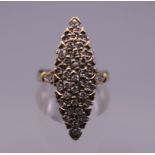 A 14 ct gold diamond marquise ring. Ring size M/N. 4.9 grammes total weight.