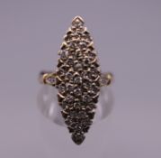 A 14 ct gold diamond marquise ring. Ring size M/N. 4.9 grammes total weight.