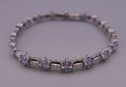 A 14 ct white gold tanzanite bracelet. 18.5 cm long. 11.9 grammes total weight.