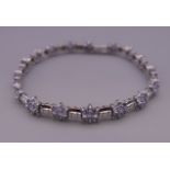 A 14 ct white gold tanzanite bracelet. 18.5 cm long. 11.9 grammes total weight.