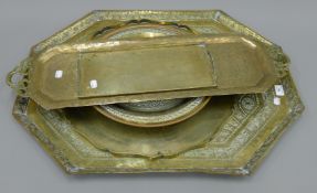 A quantity of brass trays.