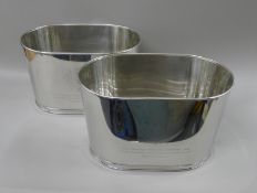 A pair of Lily Bollinger coolers. 43 cm long.