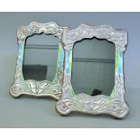 A pair of Art Nouveau style silver photograph frames. 21 cm high.
