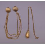 A quantity of gold plated shell form jewellery.