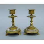 A pair of 19th century ormolu and marble candlesticks. 12 cm high.