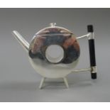 A Christopher Dresser style teapot. 14 cm high.