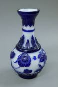 A blue and white Peking glass vase. 24 cm high.