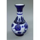 A blue and white Peking glass vase. 24 cm high.