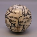 A bone globe compass. 6.5 cm high.