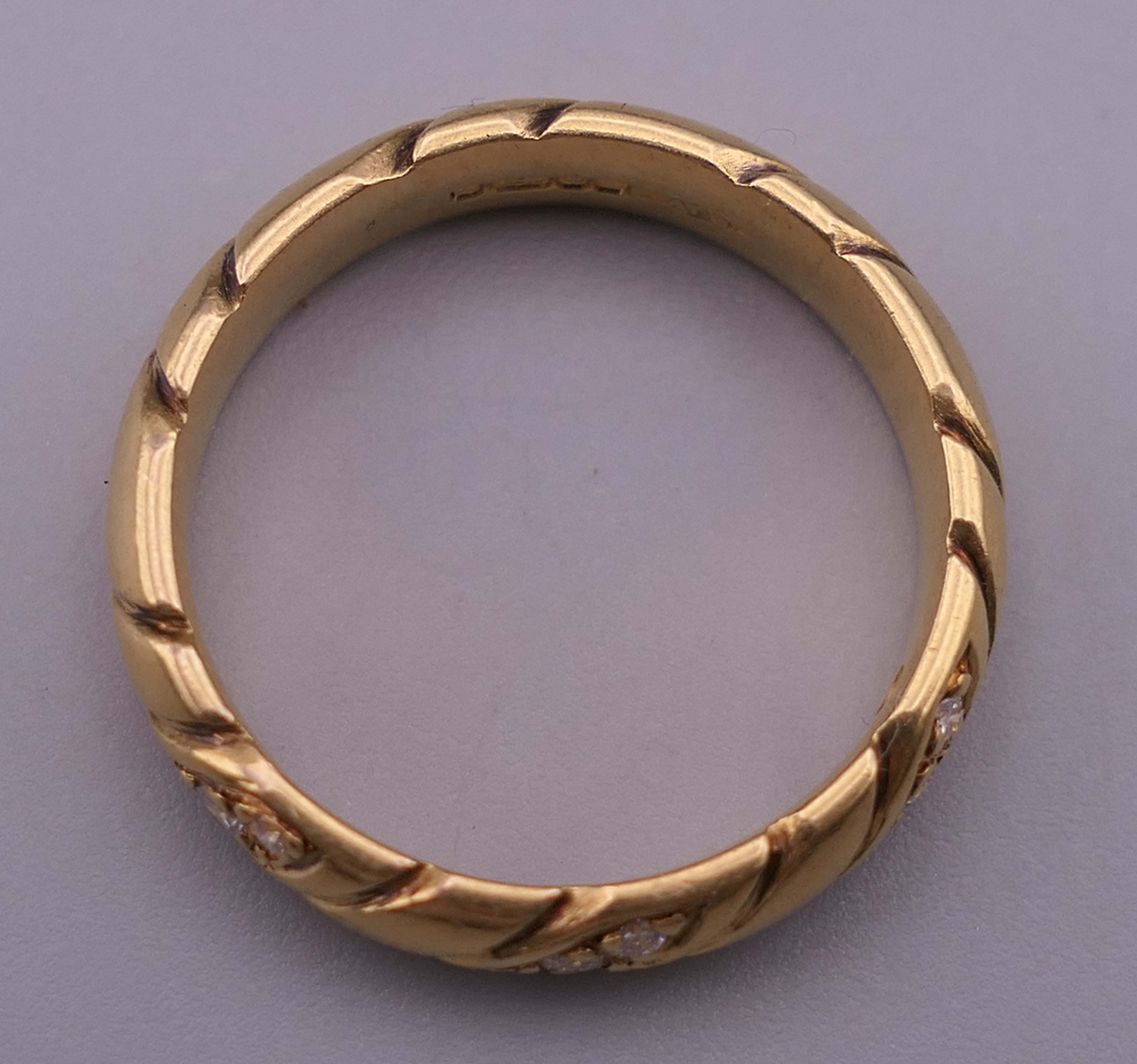 An 18 ct gold diamond set ring. Ring size P. 6.6 grammes total weight. - Image 5 of 10