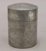 A Chinese pewter tea caddy chased with dragon and birds. 13.5 cm high.