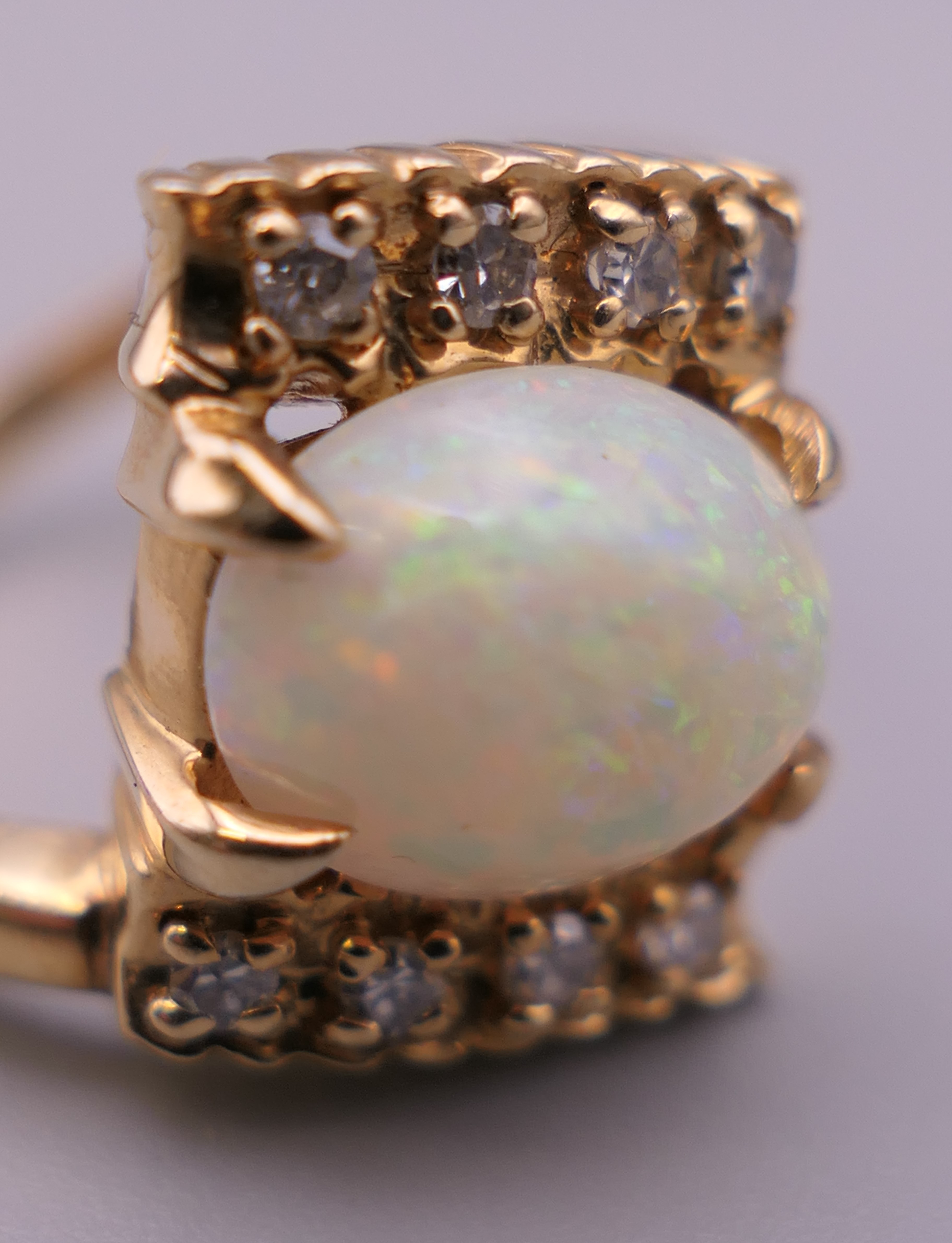 A 14 ct gold opal and diamond ring. Ring N/O. 4.8 grammes total weight. - Image 4 of 6