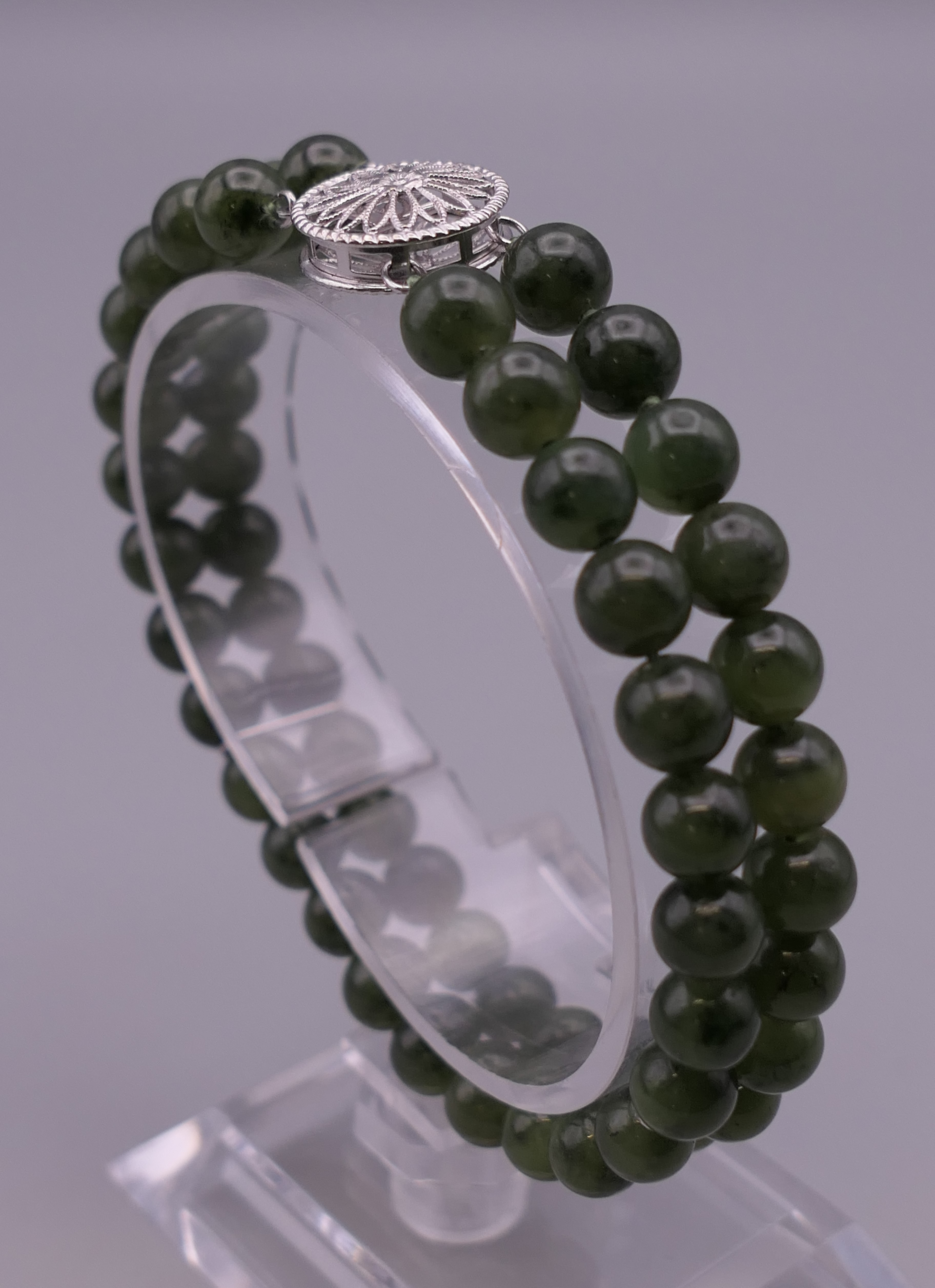 A 14 ct white gold and jade bracelet. 17.5 cm long.