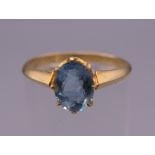 An 18 ct gold aquamarine ring. Ring size L. 2.4 grammes total weight.