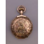 A 14 ct gold multi colour pocket watch. 4 cm wide.