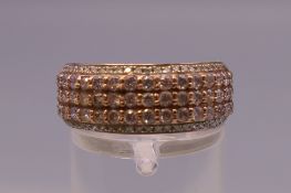 A 14 ct gold five row diamond ring. Ring size M/N. 5.2 grammes total weight.