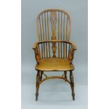 A yew wood and elm Windsor chair. 56 cm wide.