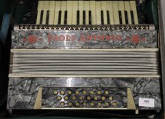 A cased Paolo Antonio accordion.