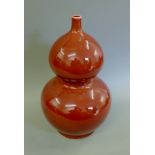 A large Chinese sang de boeuf double gourd vase. 50 cm high.