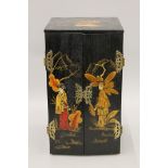 A chinoiserie table cabinet. 46 cm high.