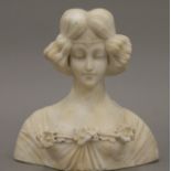 An antique Italian carved alabaster bust of a young woman. 23 cm high.