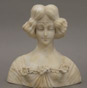An antique Italian carved alabaster bust of a young woman. 23 cm high.