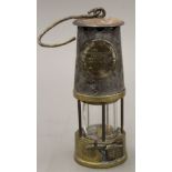 A vintage miner's lamp. 23 cm high.