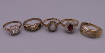 Five 9 ct gold stone set rings. 11.9 grammes total weight.