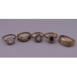 Five 9 ct gold stone set rings. 11.9 grammes total weight.