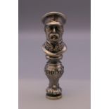 A figural seal bearing Russian marks. 8 cm high.