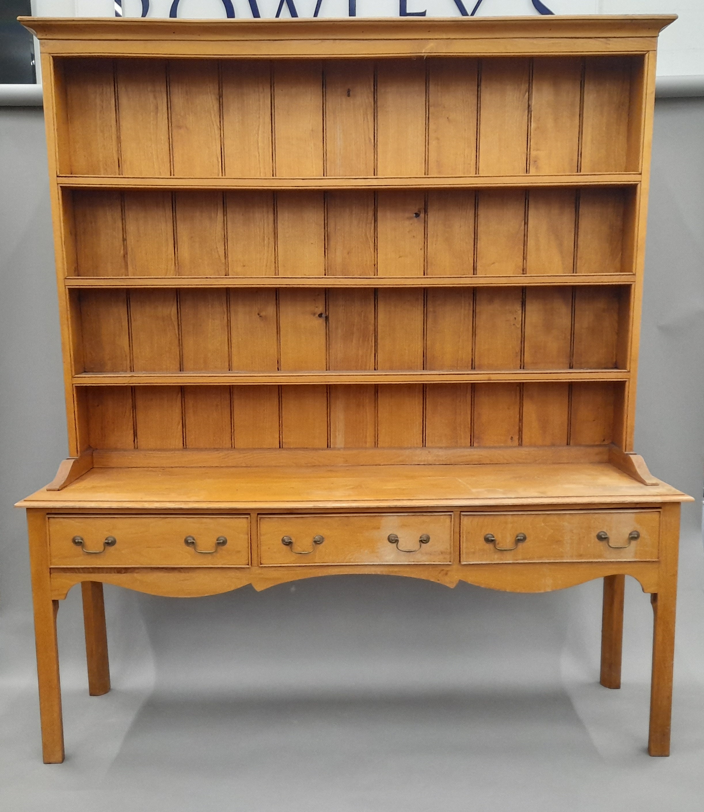 An oak three- drawer dresser. 193 cm wide, 52.5 cm deep, 222 cm high.