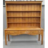 An oak three- drawer dresser. 193 cm wide, 52.5 cm deep, 222 cm high.