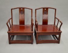 A pair of Chinese hardwood chairs. 60 cm wide.