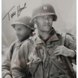 A signed photograph by Tom Hanks from Saving Private Ryan, with certificate of authenticity,