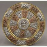 A large Indian mixed metal circular wall hanging. By repute purchased in India Between 1890-1920.