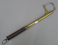 A Victorian Hardy's brass telescopic gaff with lignum handle, stamped HARDY'S ALNWICK.