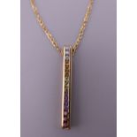 A 9 ct gold pendant and chain. The pendant 3.25 cm high. 3 grammes total weight.