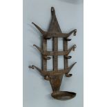 An antique iron bastar tribal toran oil lamp. 52 cm high.