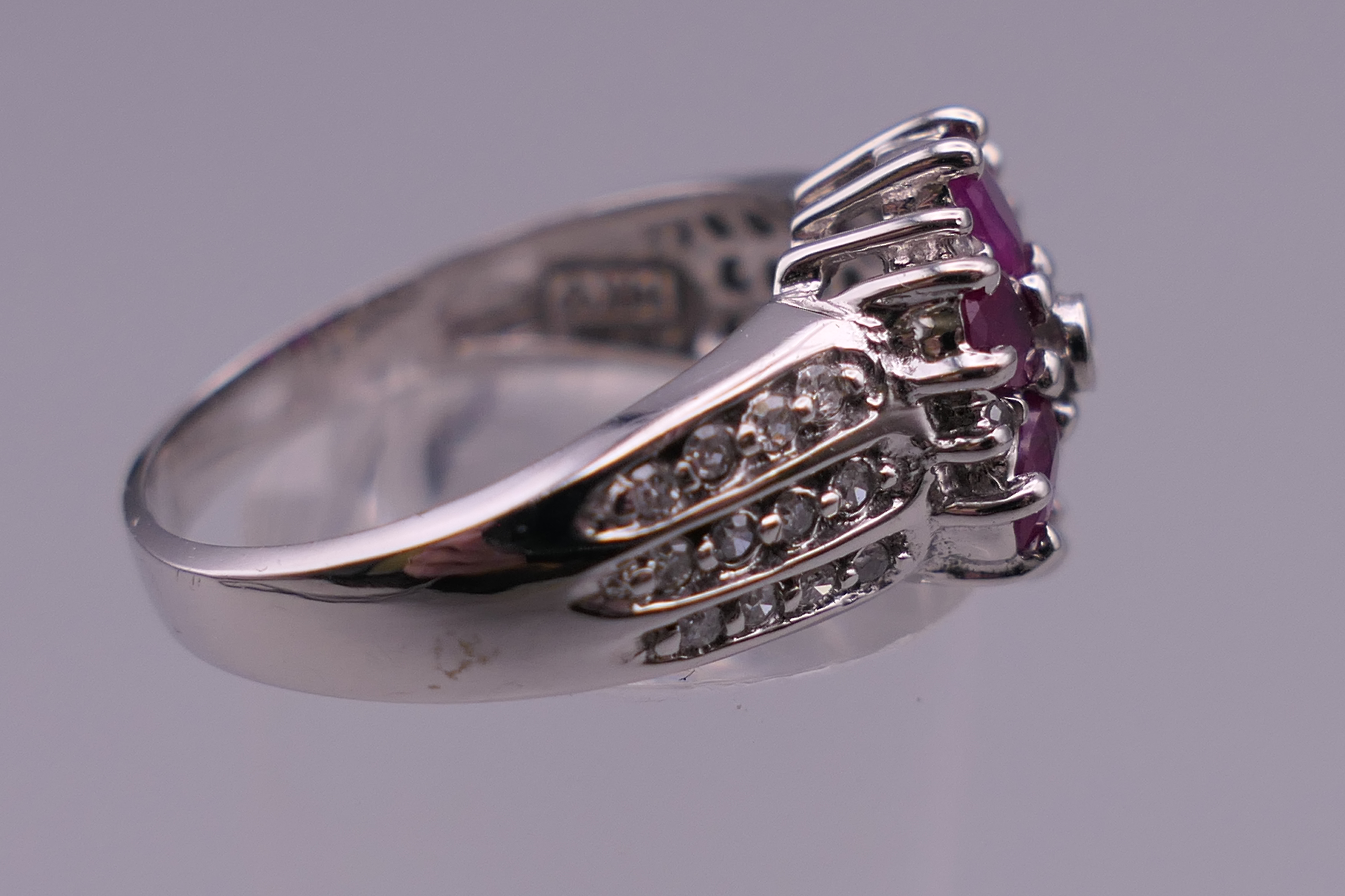 A 14 K white gold diamond and ruby ring. Ring size N/O. 4.9 grammes total weight. - Image 2 of 5