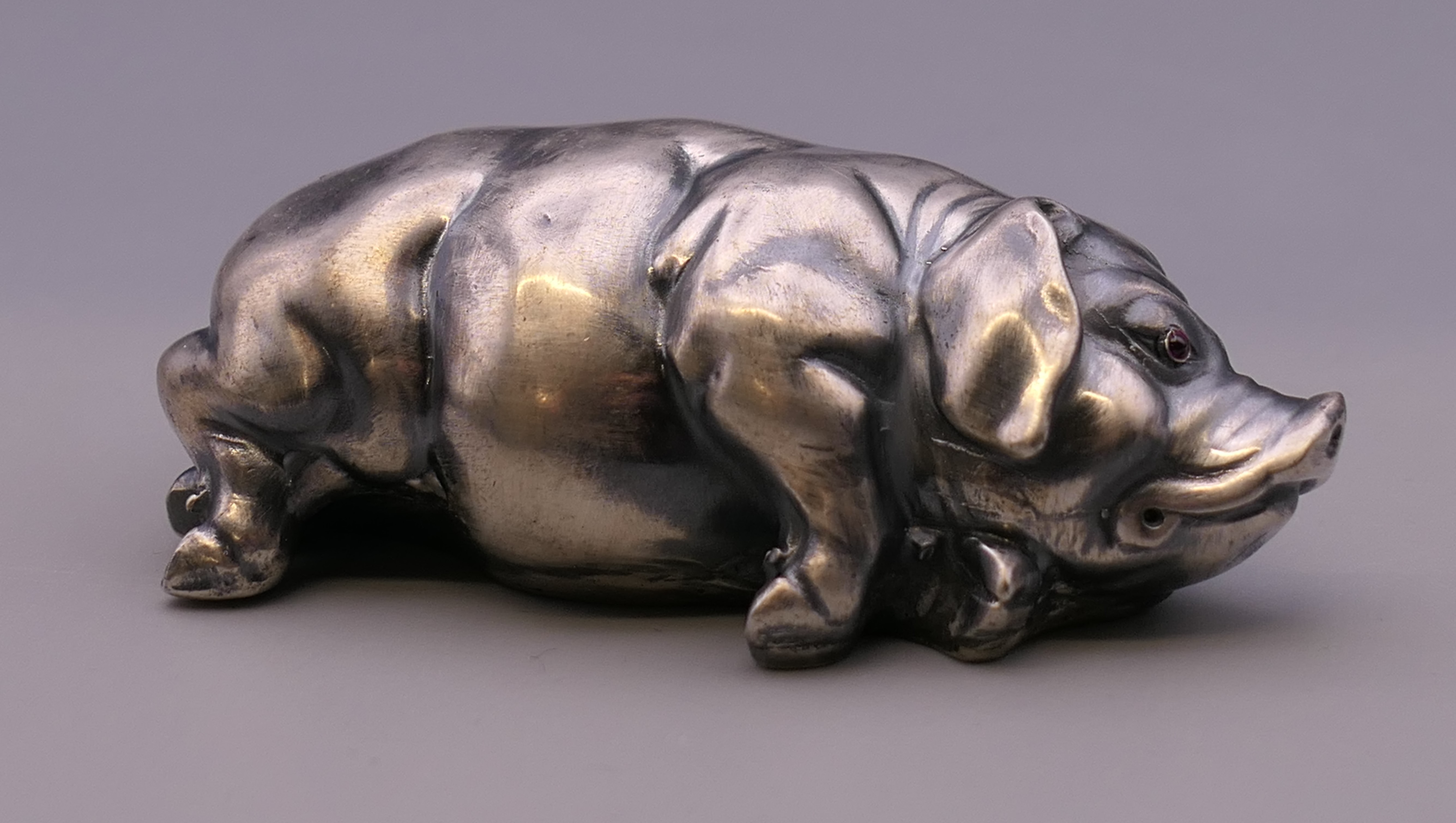 A silver model of a pig bearing Russian marks. 7 cm long. 44.6 grammes total weight.