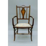 An Edwardian mahogany open armchair. 51 cm wide.