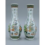 A pair of Chinese famille verte hexagonal porcelain vases. 31 cm high.