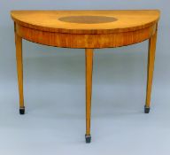 A 19th century inlaid satinwood demi lune side table. 97 cm wide.