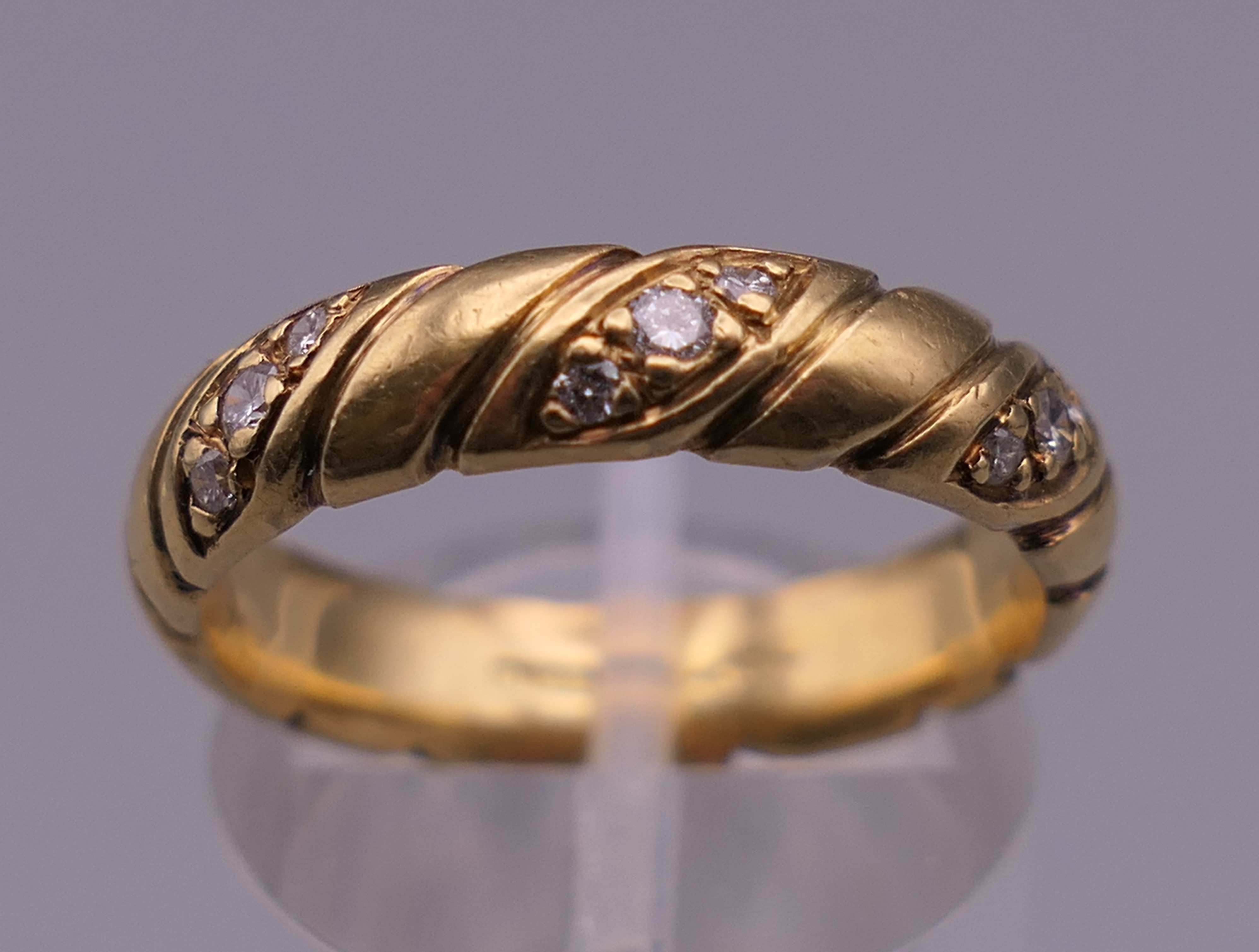 An 18 ct gold diamond set ring. Ring size P. 6.6 grammes total weight. - Image 10 of 10