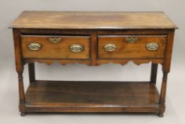 An 18th century two drawer oak dresser. 124 cm wide, 78 cm high, 47.5 cm deep.