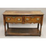 An 18th century two drawer oak dresser. 124 cm wide, 78 cm high, 47.5 cm deep.