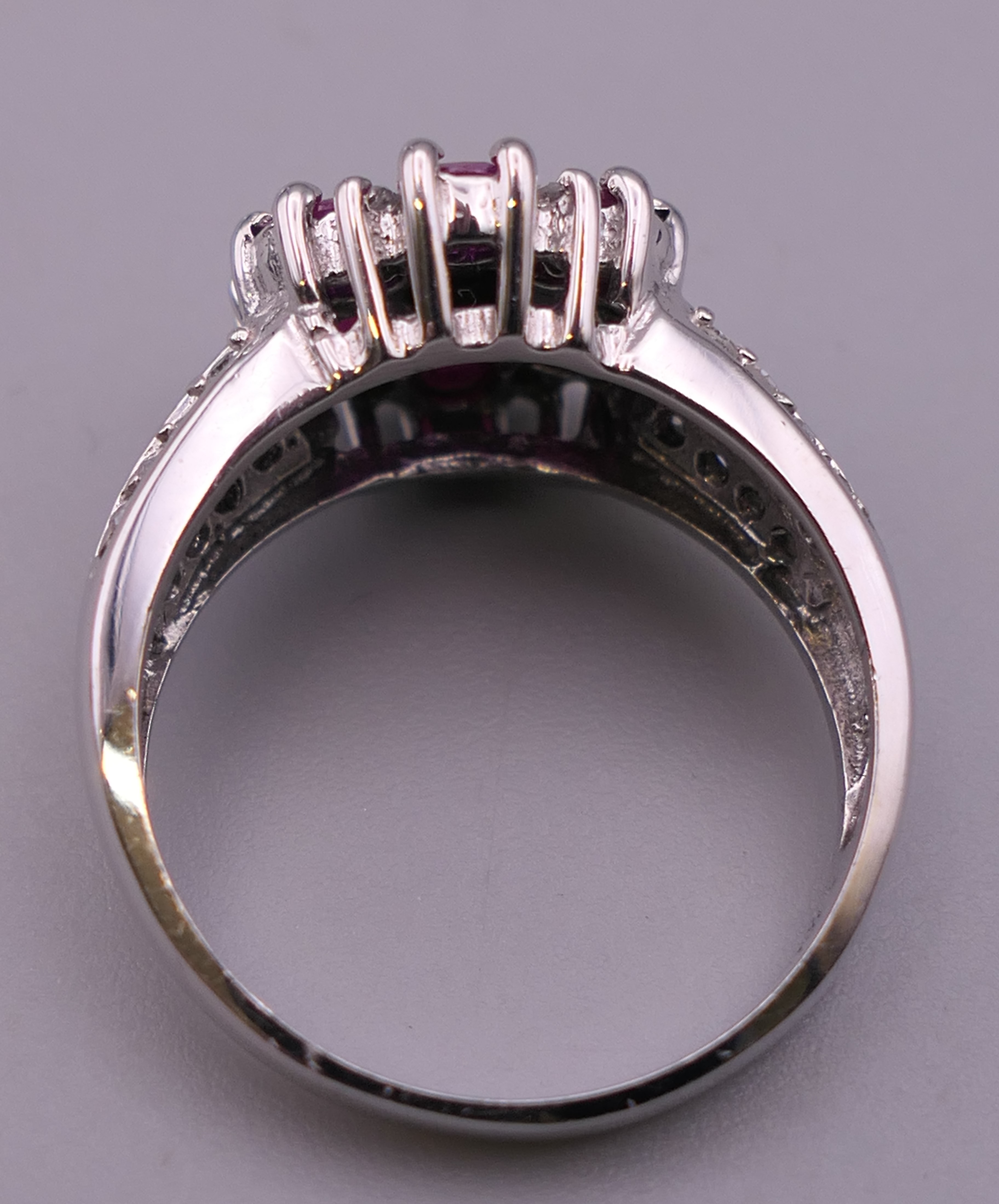 A 14 K white gold diamond and ruby ring. Ring size N/O. 4.9 grammes total weight. - Image 3 of 5